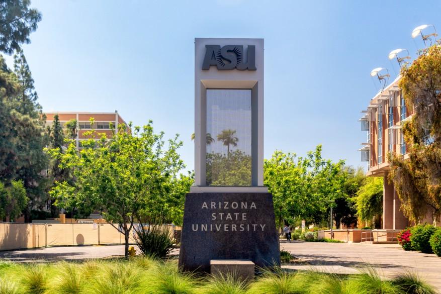 The entrance to Arizona State University is pictured with a large sculpture depicting the school's name.