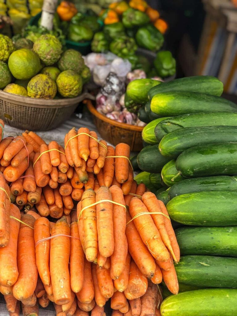 a table of fresh produce going from farm to table.